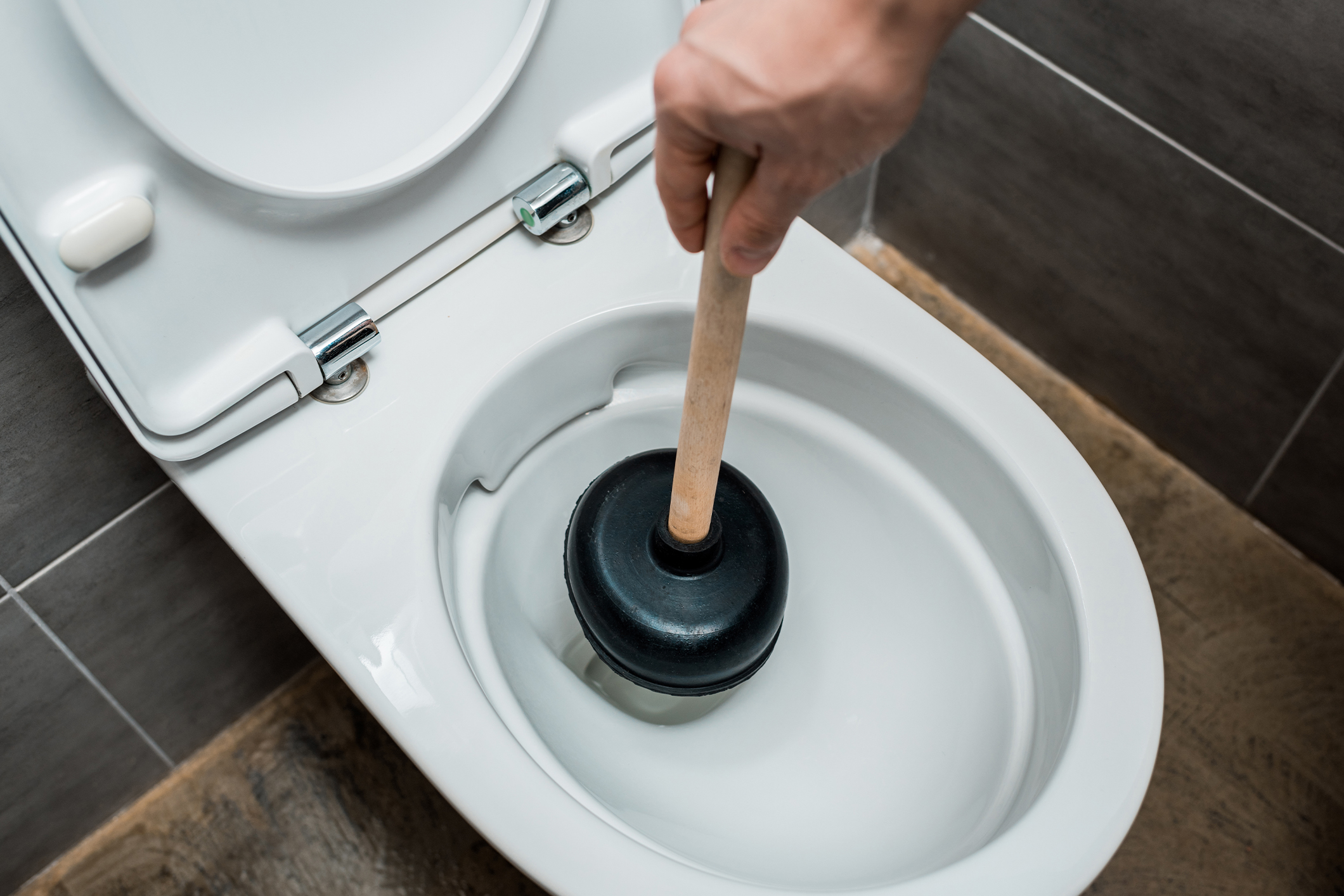 Clogged Toilets: When to DIY and When to Call the Pros